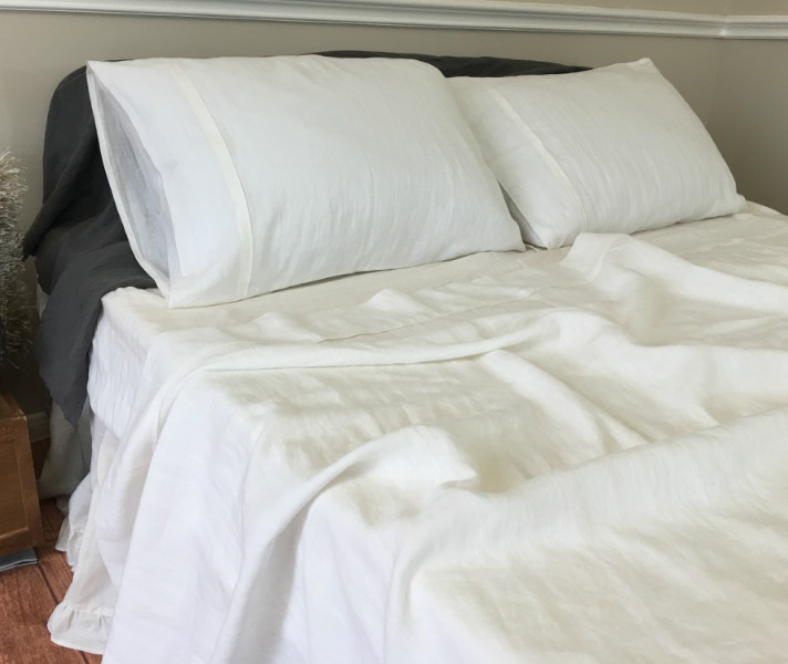 white linen bed sheets